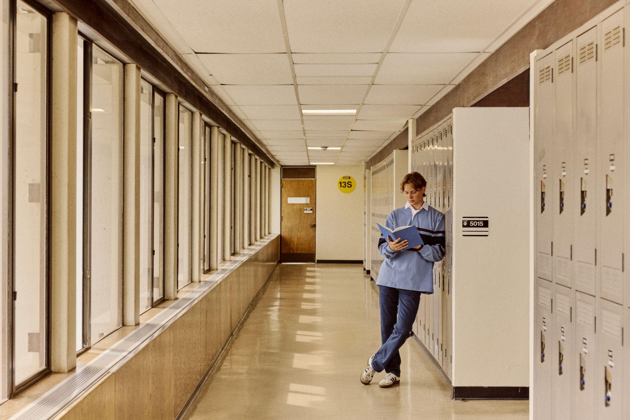 Student in hallway at SFU Burnaby.